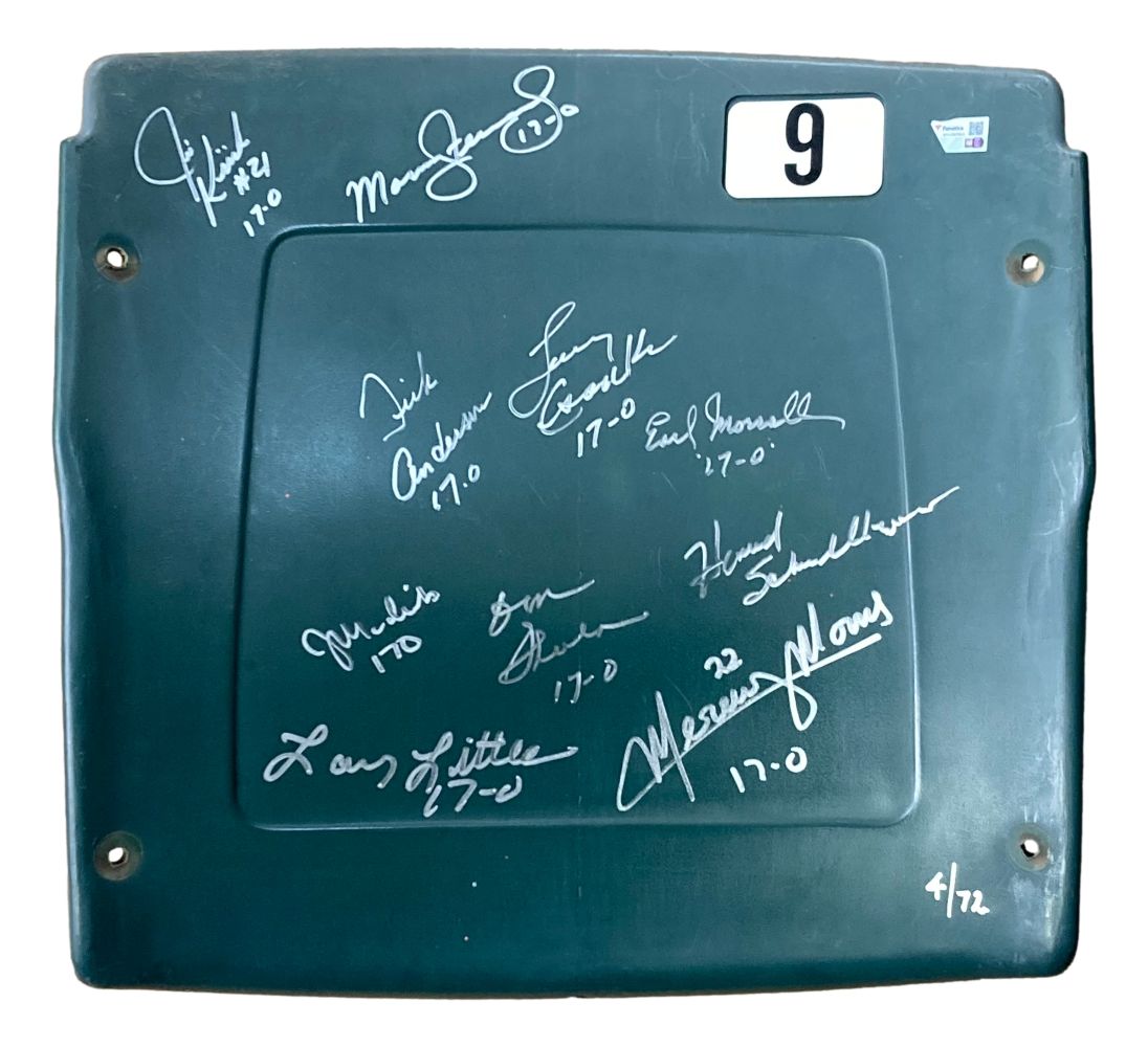 The Sports Integrity 1972 Dolphins stadium seatback, LE 4/72, features multiple white signatures, including Shula and Csonka, a green design with a “9” in the top right corner, and perfect season records like 17-0 hand-inscribed at the bottom.
