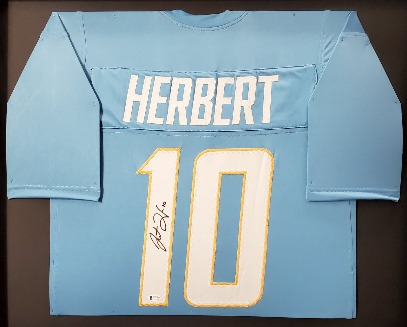 Los Angeles Chargers Justin Herbert Autographed Framed Powder Blue Jersey Beckett BAS Stock #191176