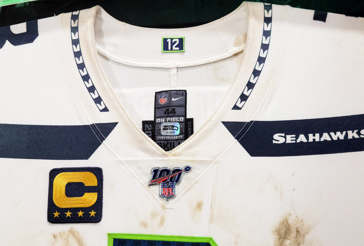 Russell Wilson Framed Game Used Seattle Seahawks White Nike Jersey With Captain's Patch & NFL 100 Logo Unsigned SKU #203517