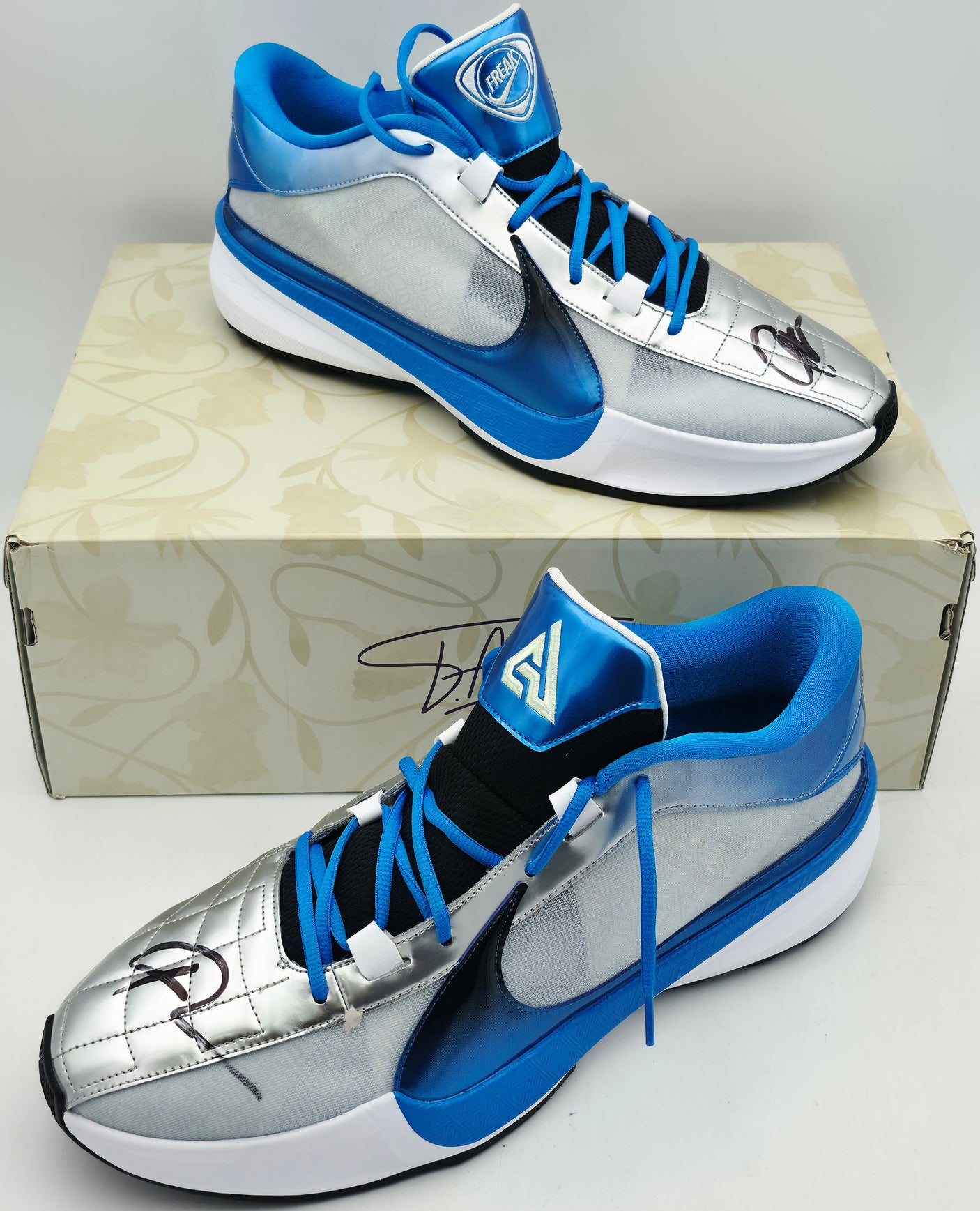 Giannis Antetokounmpo Autographed White, Metalic Blue & Metallic Silver Nike ZOOM FREAK 5 Shoes Milwaukee Bucks Size 17 (With Box) Beckett BAS Witness #3W396331 & #3W396332