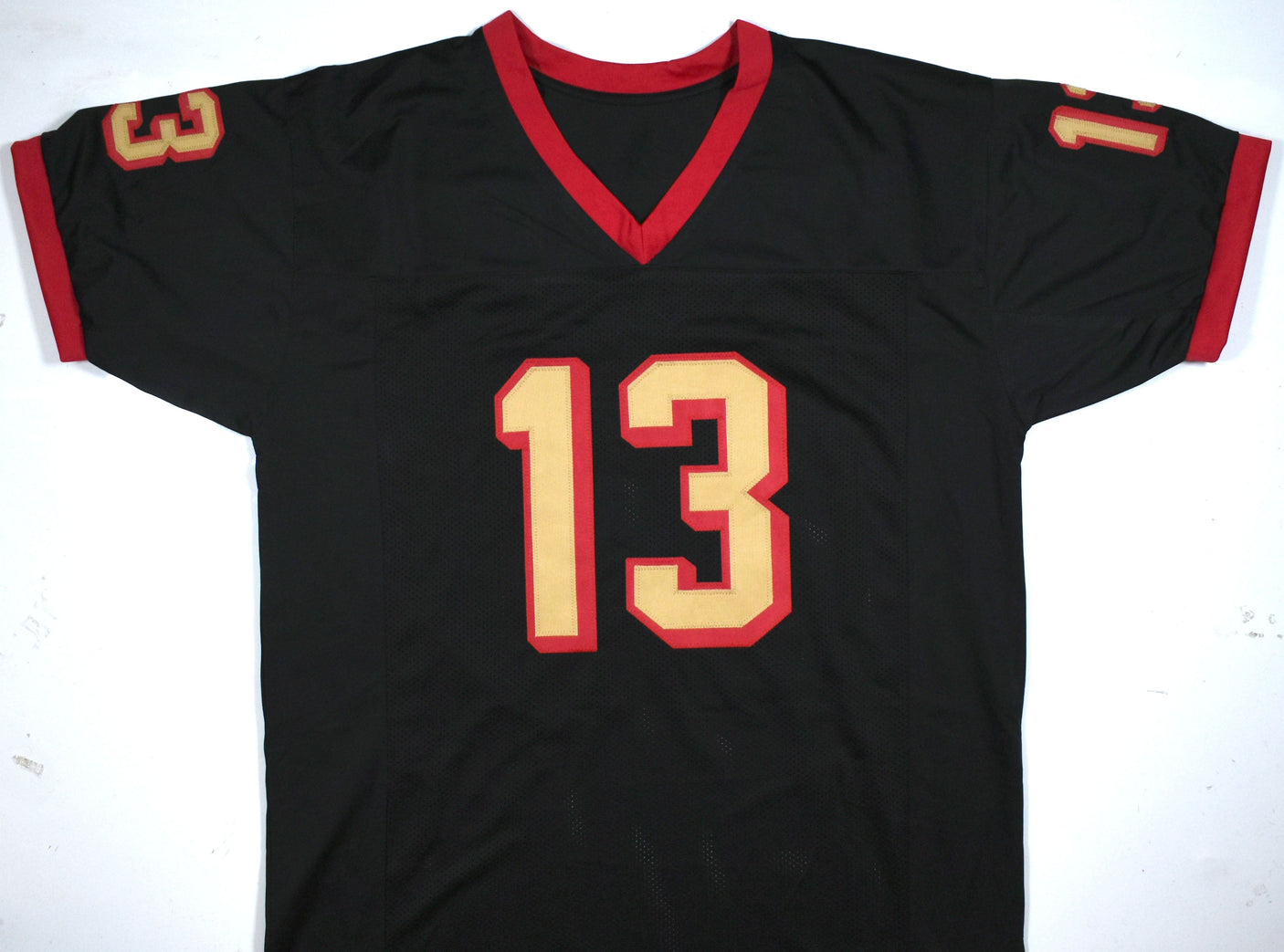 Kurt Warner Autographed Black Pro Style Jersey-Beckett W Hologram *Black