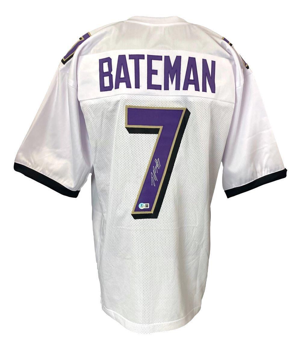 The Sports Integrity Rashod Bateman Baltimore Signed White Football Jersey BAS features purple and gold accents, BATEMAN and number 7 on the back, with the number 7 signed in white ink.