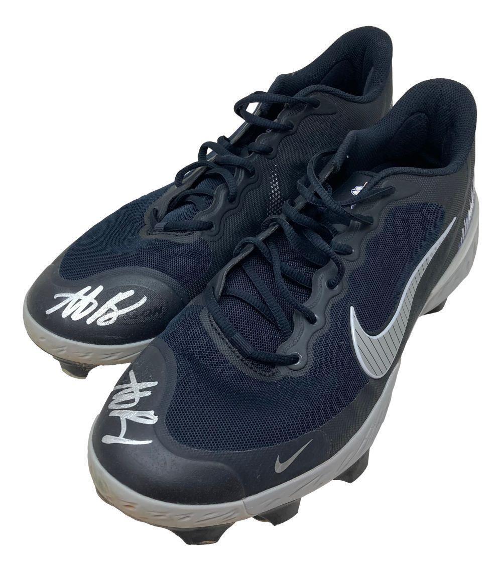 A pair of Anthony Rizzo twice signed 2023 game-used Yankees Nike cleats by Sports Integrity, featuring black uppers, white soles, silver swooshes, and a white autograph on one toe.