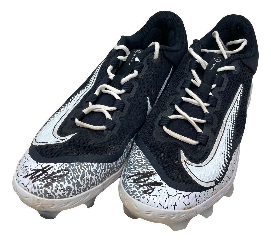 A pair of Anthony Rizzo signed 2024 game-used Yankees Nike cleats by Sports Integrity, featuring black-and-white design, white laces, textured soles, black-and-gray patterned toes, and visible autographs.