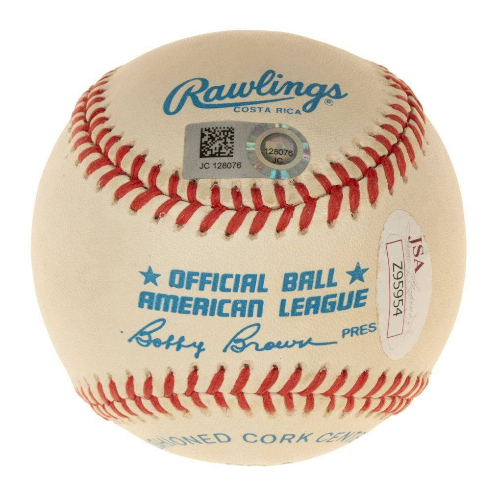 Sports Integrity Mickey Mantle Mike Trout Signed American League Baseball, features red stitching, "OFFICIAL BALL AMERICAN LEAGUE" in blue, Bobby Brown’s signature, and JSA authentication sticker Z95954 attached.