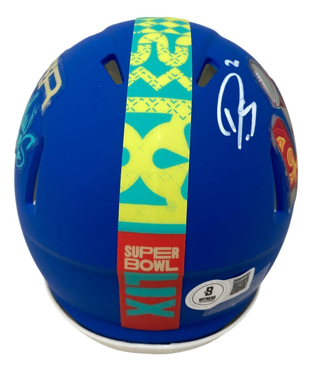 The Sports Integrity Darius Slay Signed Eagles Super Bowl LIX Mini Speed Helmet BAS features a blue design, yellow and green stripe, white autograph on the left, bold graphics, and several stickers displayed from the back.