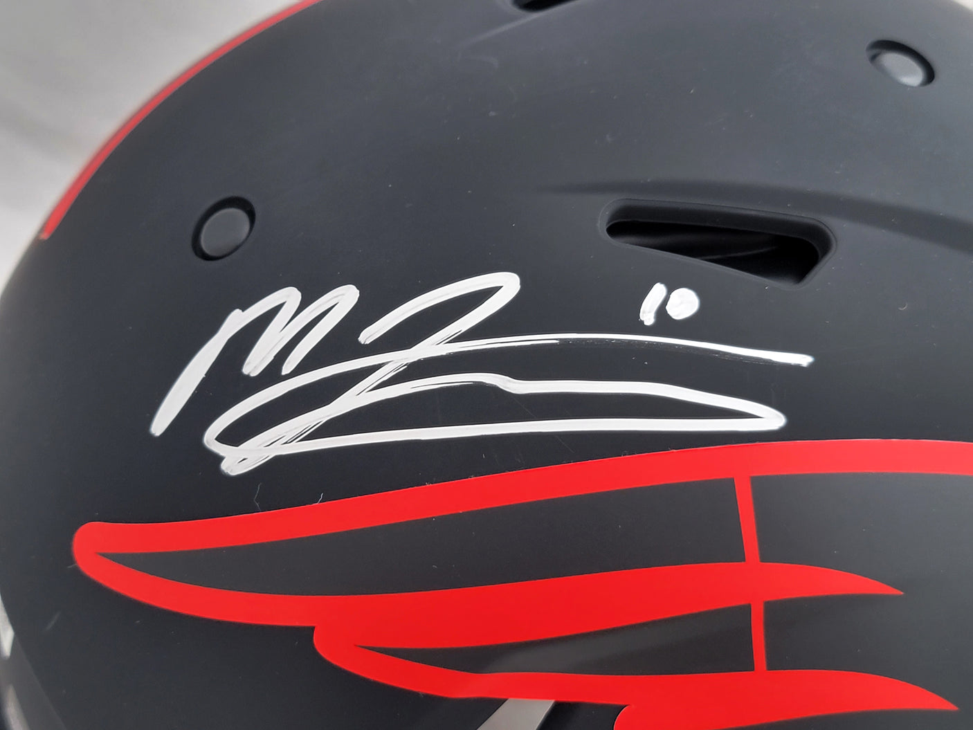 Mac Jones Autographed New England Patriots Eclipse Black Full Size Authentic Speed Helmet Beckett BAS Witness Stock #206517