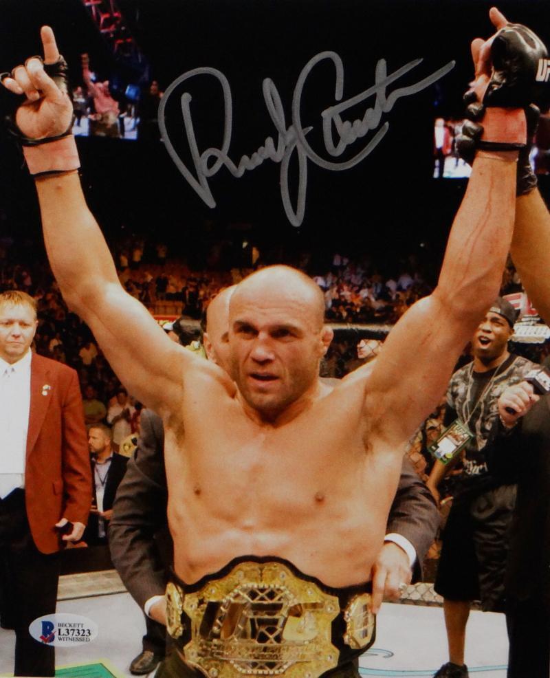 Randy Couture Autographed MMA 8x10 Photo With Belt- Beckett Auth *Silver
