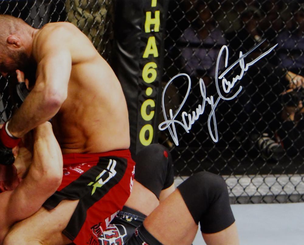 Randy Couture Autographed MMA 16x20 On Top Punching Photo- Beckett Auth *White