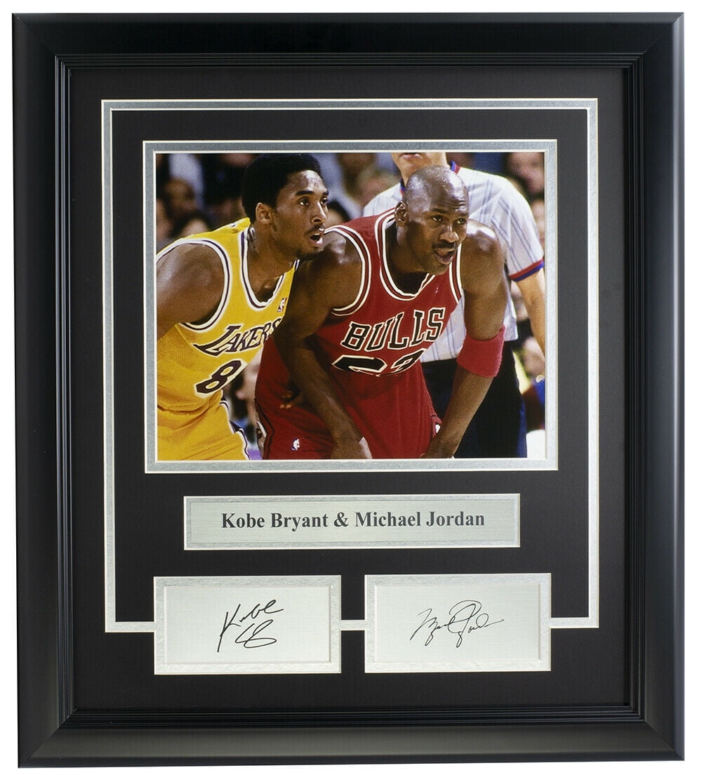 Sports Integrity Kobe Bryant & Michael Jordan Framed 8x10 Photo features both legends in Lakers and Bulls jerseys, with a labeled plaque and laser-engraved signatures displayed below.