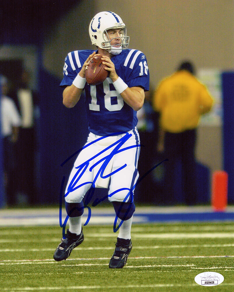 Peyton Manning Signed Indianapolis Colts Blue Jersey Two Hands On Ball Action 8x10 Photo - (JSA COA)
