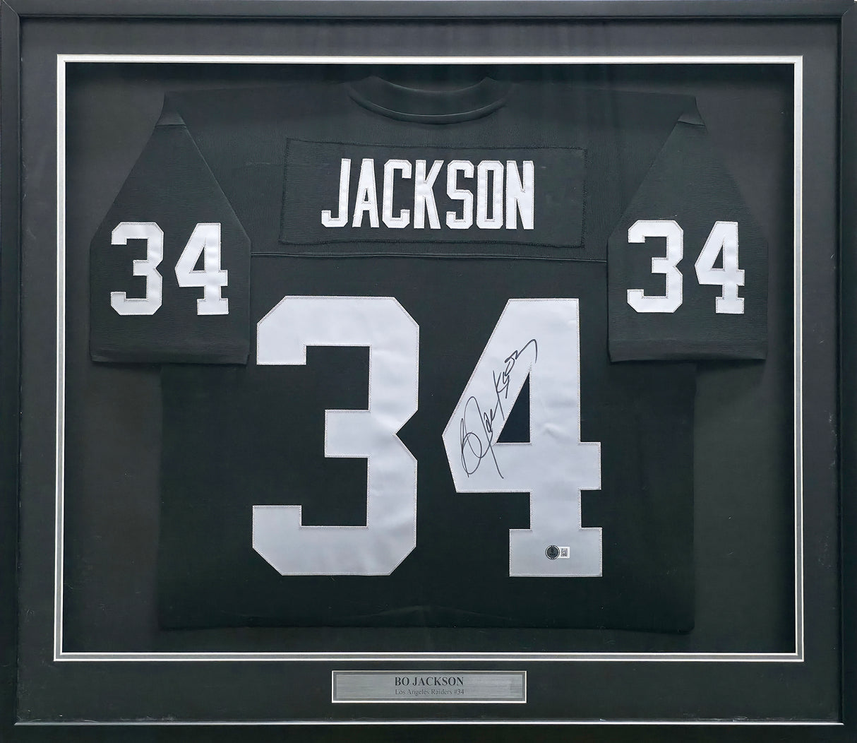 Oakland Raiders Bo Jackson Autographed Framed Black Jersey (Dent) Beckett BAS Witness #1W615199