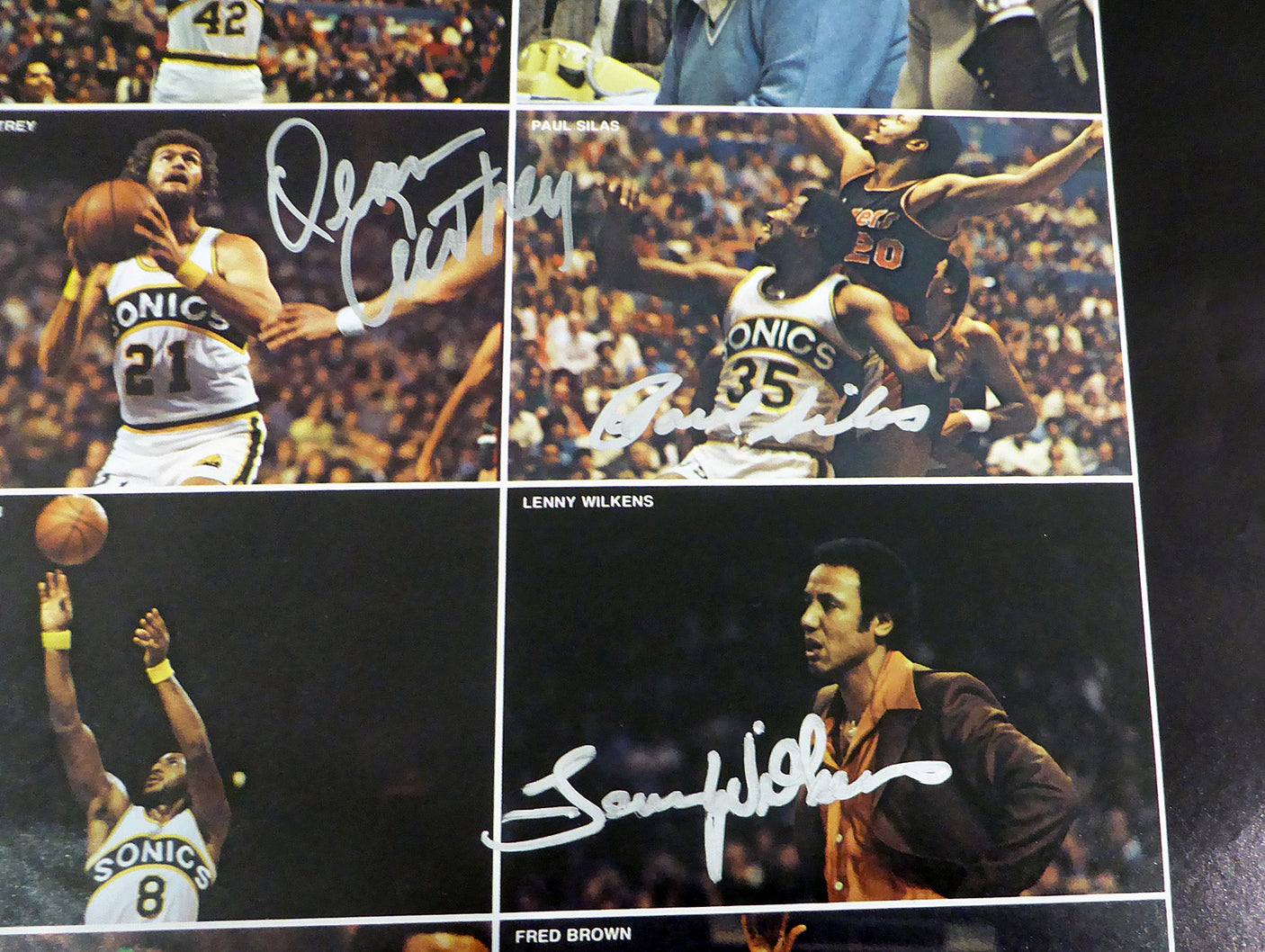 1978-79 NBA Champions Seattle Supersonics Autographed 17x22 Poster Photo With 9 Total Signatures Including Fred Brown & Lenny Wilkens MCS Holo #51045