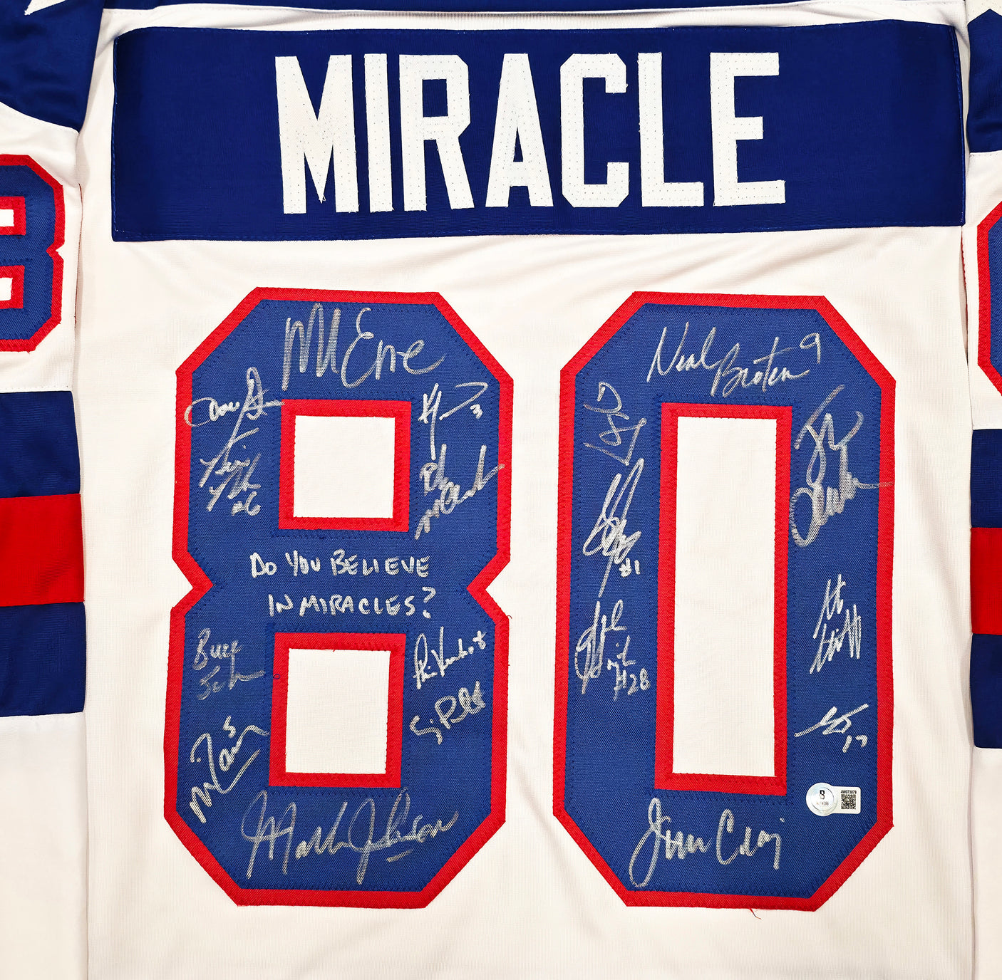 1980 Team USA Miracle on Ice Autographed White Jersey "Do You Believe In Miracles?!" With 18 Signatures Including Eruzione & Craig Beckett BAS Witness Stock #254436