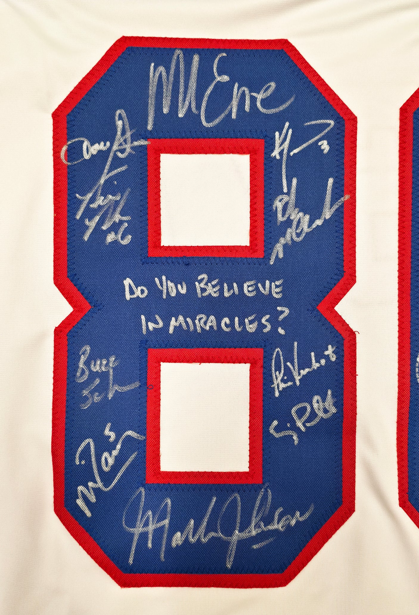 1980 Team USA Miracle on Ice Autographed White Jersey "Do You Believe In Miracles?!" With 18 Signatures Including Eruzione & Craig Beckett BAS Witness Stock #254436
