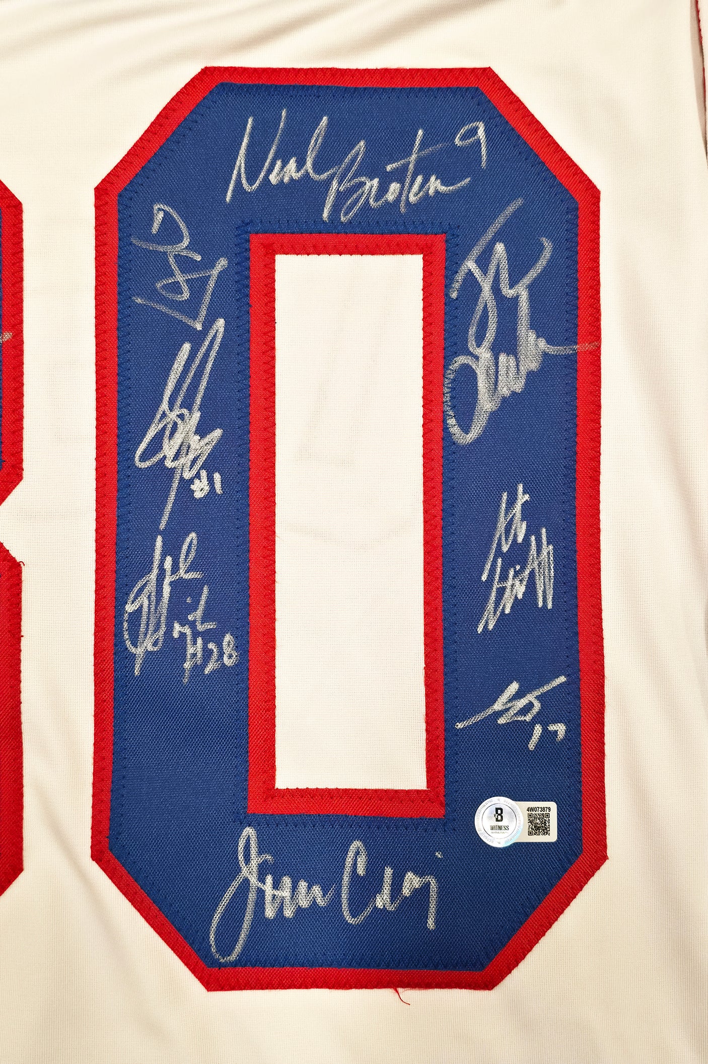 1980 Team USA Miracle on Ice Autographed White Jersey "Do You Believe In Miracles?!" With 18 Signatures Including Eruzione & Craig Beckett BAS Witness Stock #254436
