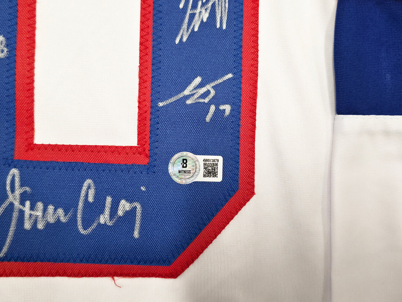 1980 Team USA Miracle on Ice Autographed White Jersey "Do You Believe In Miracles?!" With 18 Signatures Including Eruzione & Craig Beckett BAS Witness Stock #254436