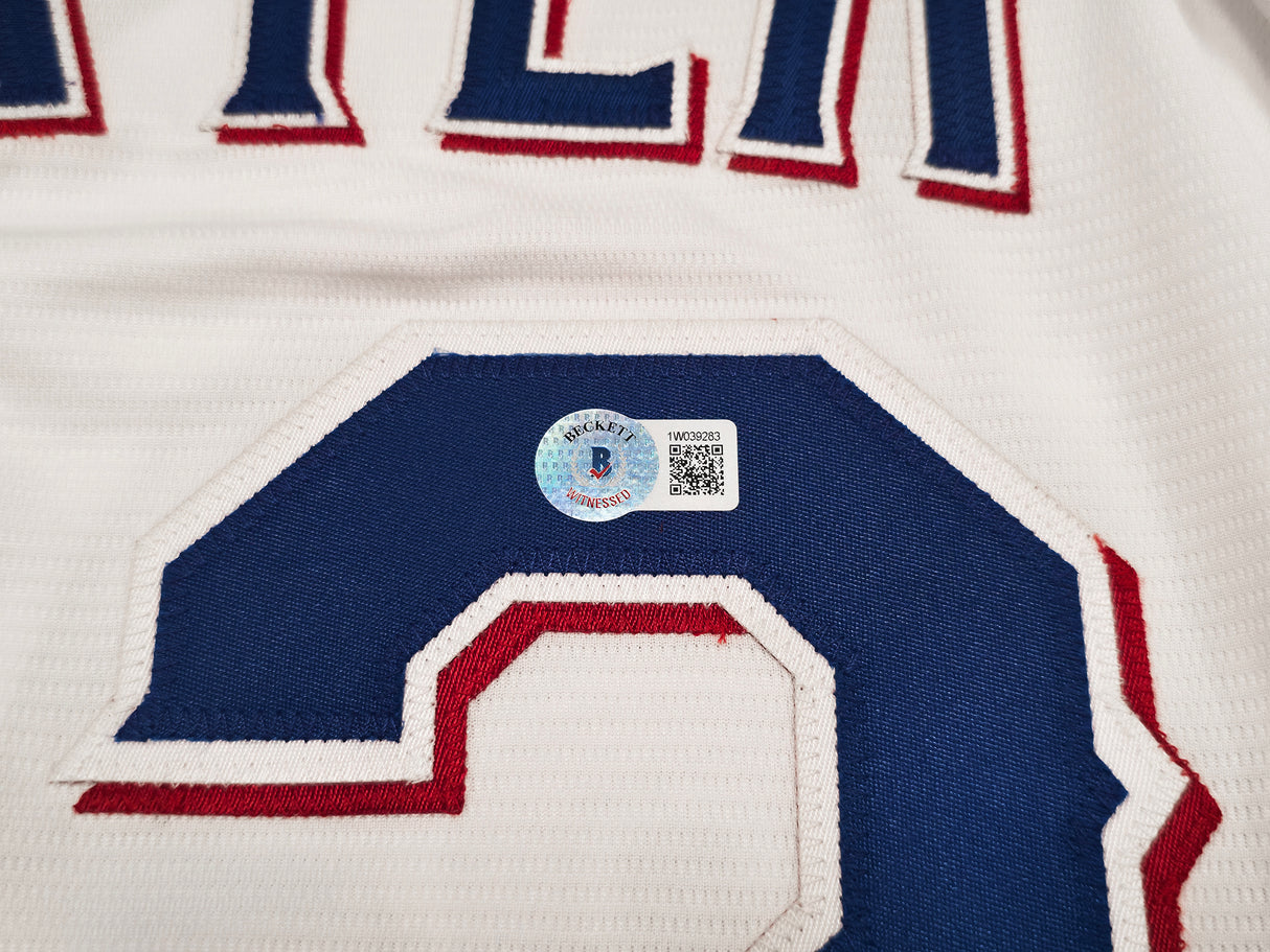 Texas Rangers Evan Carter Autographed White Nike Jersey Size XL "23 WS Champs" Beckett BAS Witness Stock #252437