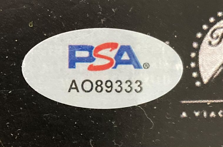 An oval PSA/DNA sticker featuring the blue and red logo and code AO89333 appears on this Sports Integrity Al Pacino Signed 11x17 The Godfather Photo, set against a dark background.