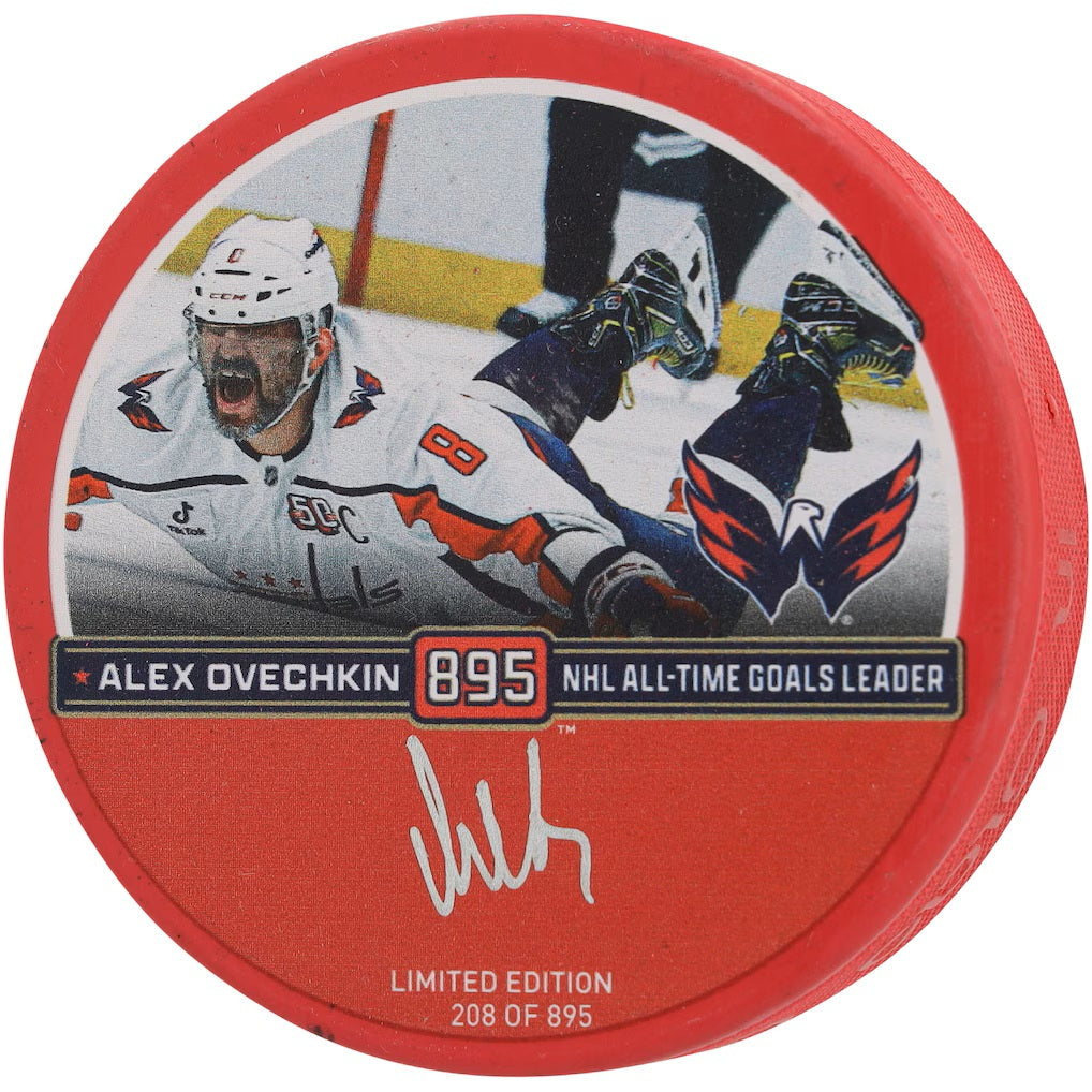 The Sports Integrity Alexander Ovechkin Signed Washington Capitals Red Goal 895 Logo Puck features Ovechkin's celebration image, Capitals logo, his name, 895 NHL All-Time Goals Leader, signature, and is Limited Edition 208 of 895.