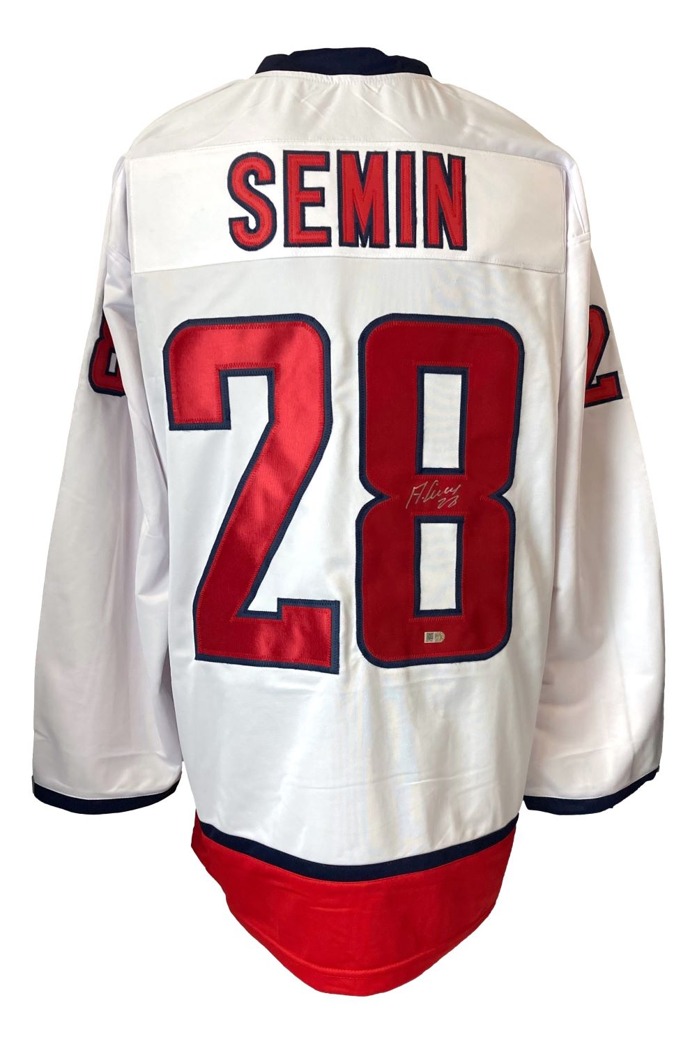The Alexander Semin Washington Signed White Hockey Jersey by Sports Integrity features red and blue accents, SEMIN and number 28 on the back, plus an autograph on the number 8.