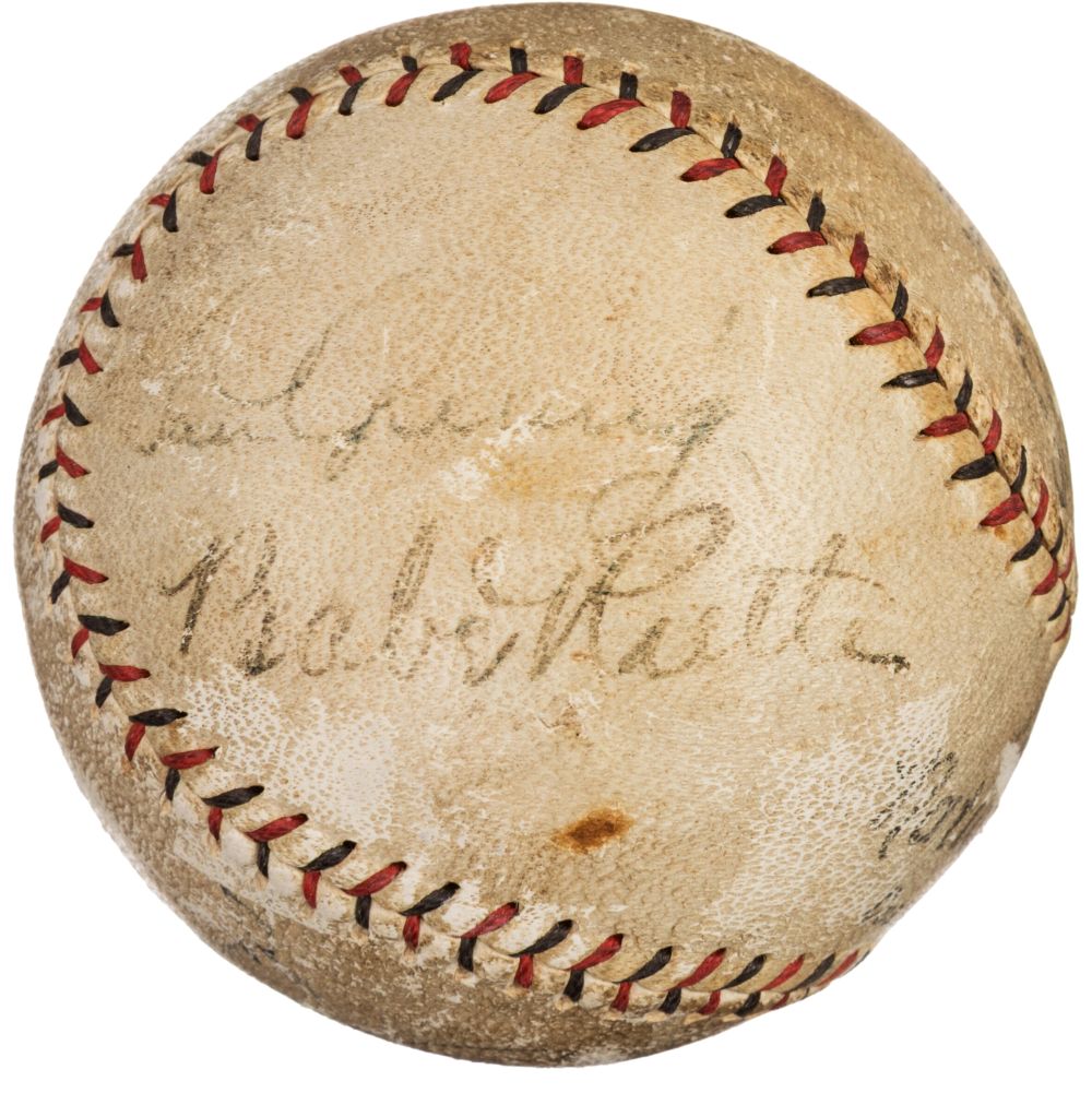 A vintage Spalding baseball by Sports Integrity features visible red stitching, faded handwriting, and signatures of Babe Ruth and Lou Gehrig from the New York Yankees, authenticated with PSA+BAS LOA.
