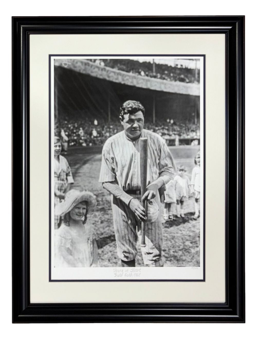Sports Integrity Babe Ruth New York Yankees Framed Young At Heart Historical Archive Giclee features a black and white photo of Babe Ruth in uniform holding a bat with children nearby and a stadium full of spectators in the background.