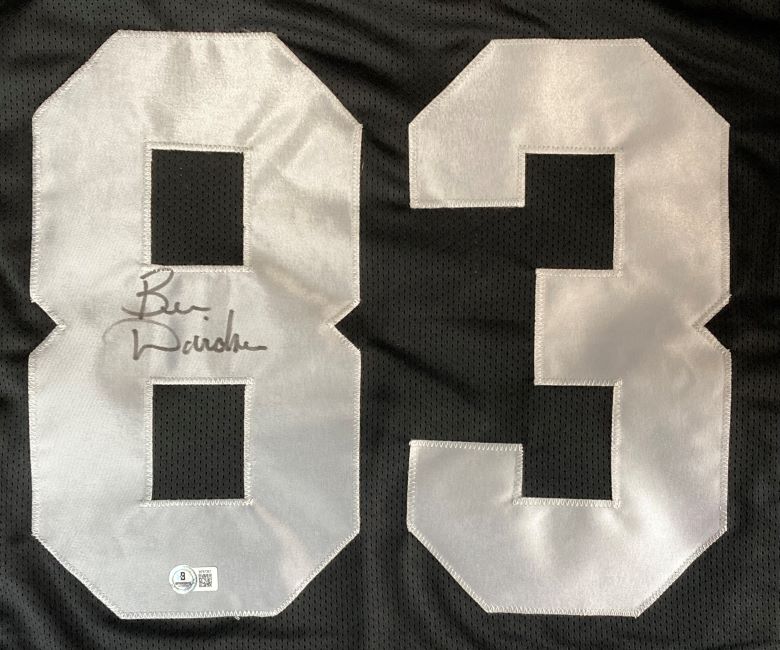 A Ben Davidson Oakland signed black football jersey by Sports Integrity, featuring a large white number 83 with the left 8 autographed in black marker and a BAS authentication sticker on the lower left of the 8.