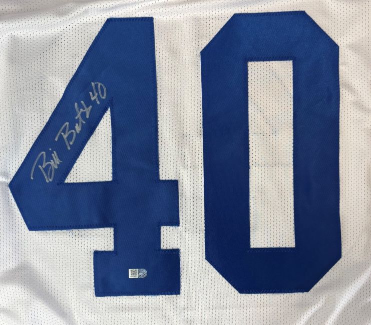 The Bill Bates Dallas Signed White Football Jersey by Sports Integrity features a large blue number 40 and an autograph in silver marker on the number 4.