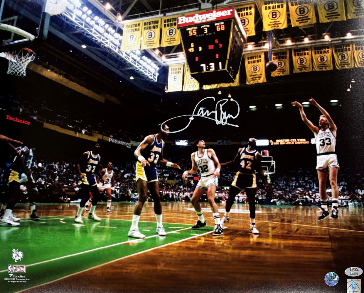 Larry Bird shoots over Lakers defenders in this signed 16x20 photo (Sports Integrity), capturing a classic Boston Celtics vs. Lakers moment with championship banners above the court. Authenticated by PSA/DNA.