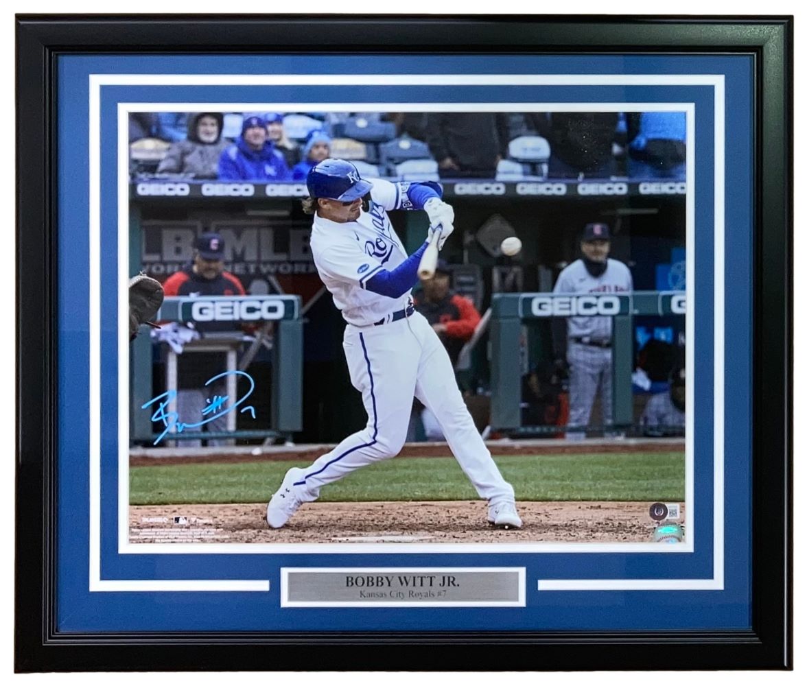 The Sports Integrity Bobby Witt Jr Signed Framed 16x20 Kansas City Royals Photo features an autograph and nameplate, showing Witt in a white Royals uniform swinging a bat during a game. BAS ITP authenticated.