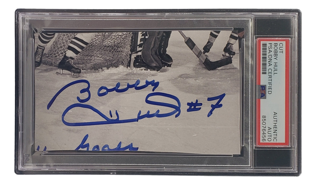 Sports Integrity’s Bobby Hull Signed Slabbed Chicago Blackhawks Cut Signature features “Bobby Hull #7” in blue ink, PSA/DNA authenticated as 85076456, and encased with a “CUT BOBBY HULL AUTHENTIC” label.