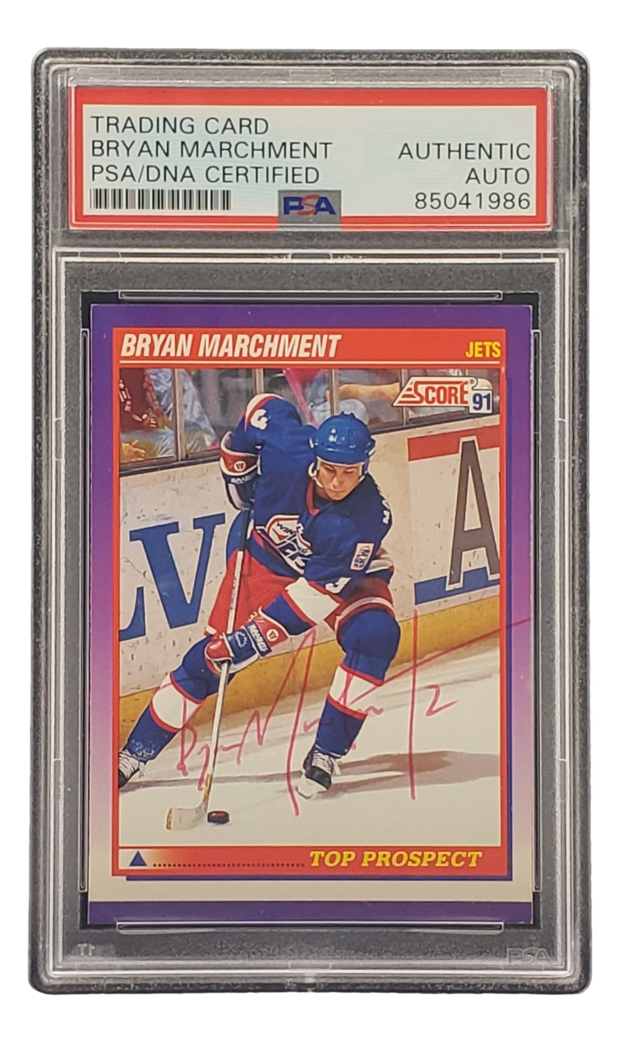 The Sports Integrity Bryan Marchment Signed 1991 Score #314 Winnipeg Jets Hockey Card features his red ink autograph, comes in a protective PSA/DNA certified case, and is labeled Top Prospect.