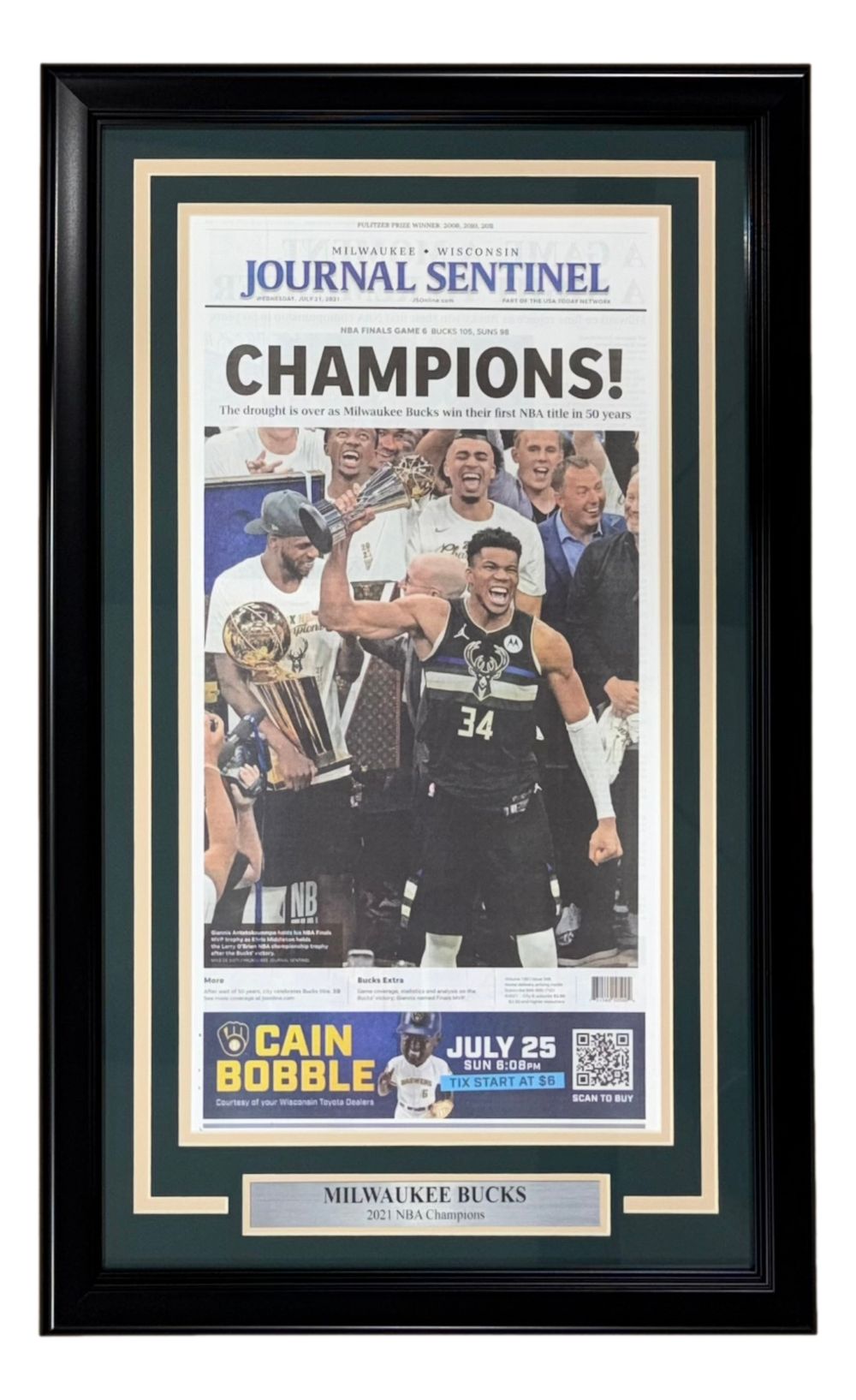 The Sports Integrity Milwaukee Bucks Framed 2021 NBA Champions Milwaukee Journal Sentinel Newspaper displays the “CHAMPIONS!” front page, with Bucks players celebrating their 2021 victory and a plaque reading “Milwaukee Bucks 2021 NBA Champions.”.