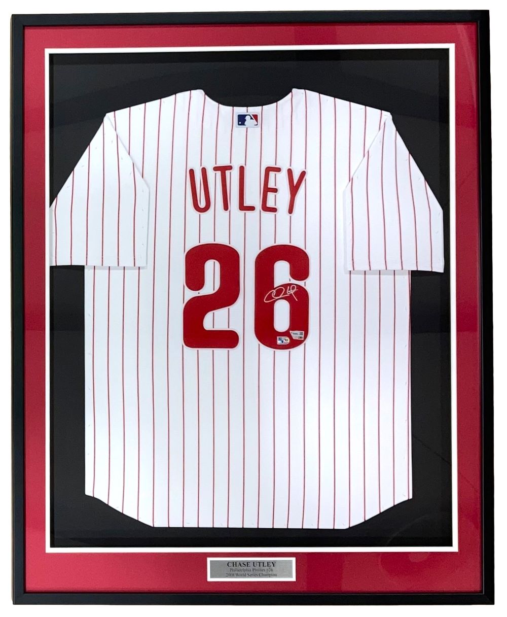 The Sports Integrity Chase Utley Signed Framed Philadelphia Phillies Nike Limited Jersey features UTLEY and 26 in red, an autograph on the number, red pinstripes, a white background, a black/red border, and a nameplate.