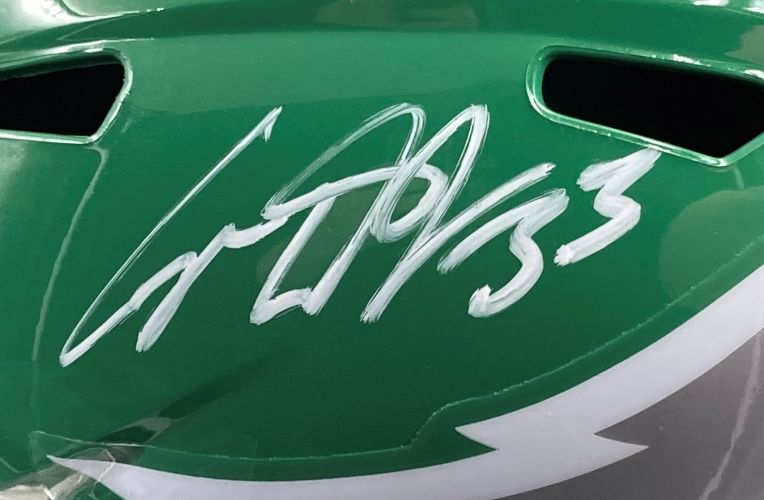 A Cooper DeJean Signed Eagles FS Kelly Green Replica Helmet by Sports Integrity, featuring a bold white signature and "53" in silver marker, displayed in a Super Bowl 59 LIX case.