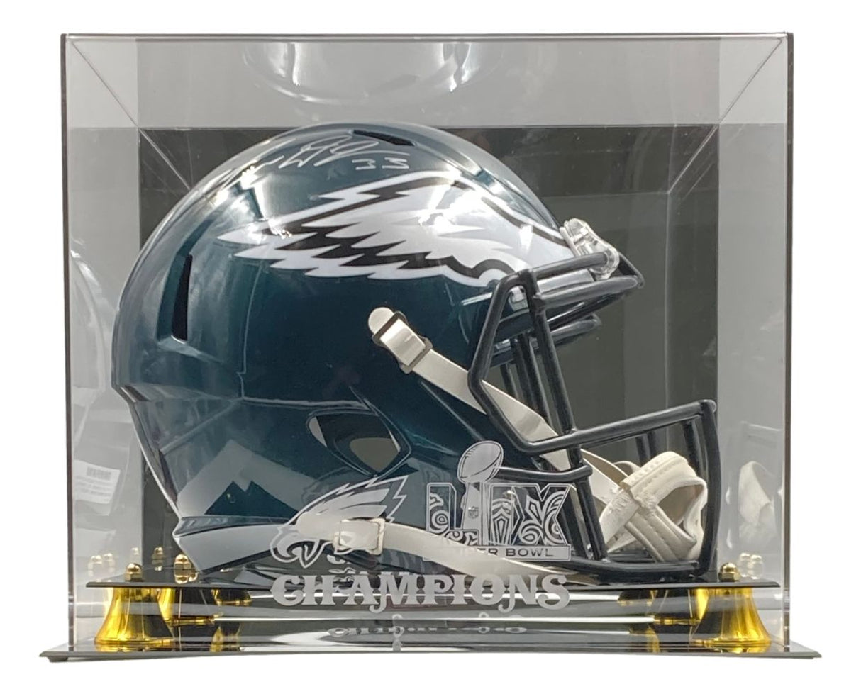 A Cooper DeJean signed Eagles FS replica helmet by Sports Integrity is displayed in a Super Bowl 59 LIX Fanatics case, with the helmet and case resting on a black base with gold accents.