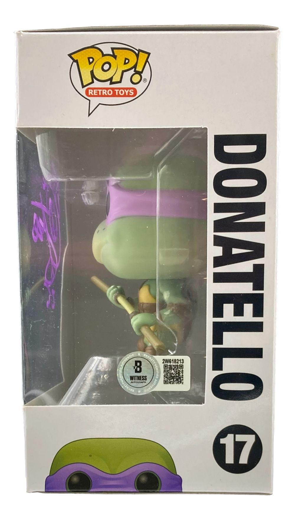 A Corey Feldman signed Teenage Mutant Ninja Turtles Funko Pop #17 by Sports Integrity is displayed in its box, featuring a purple signature on the clear window and Donatello’s name vertically. Peace BAS authenticated.