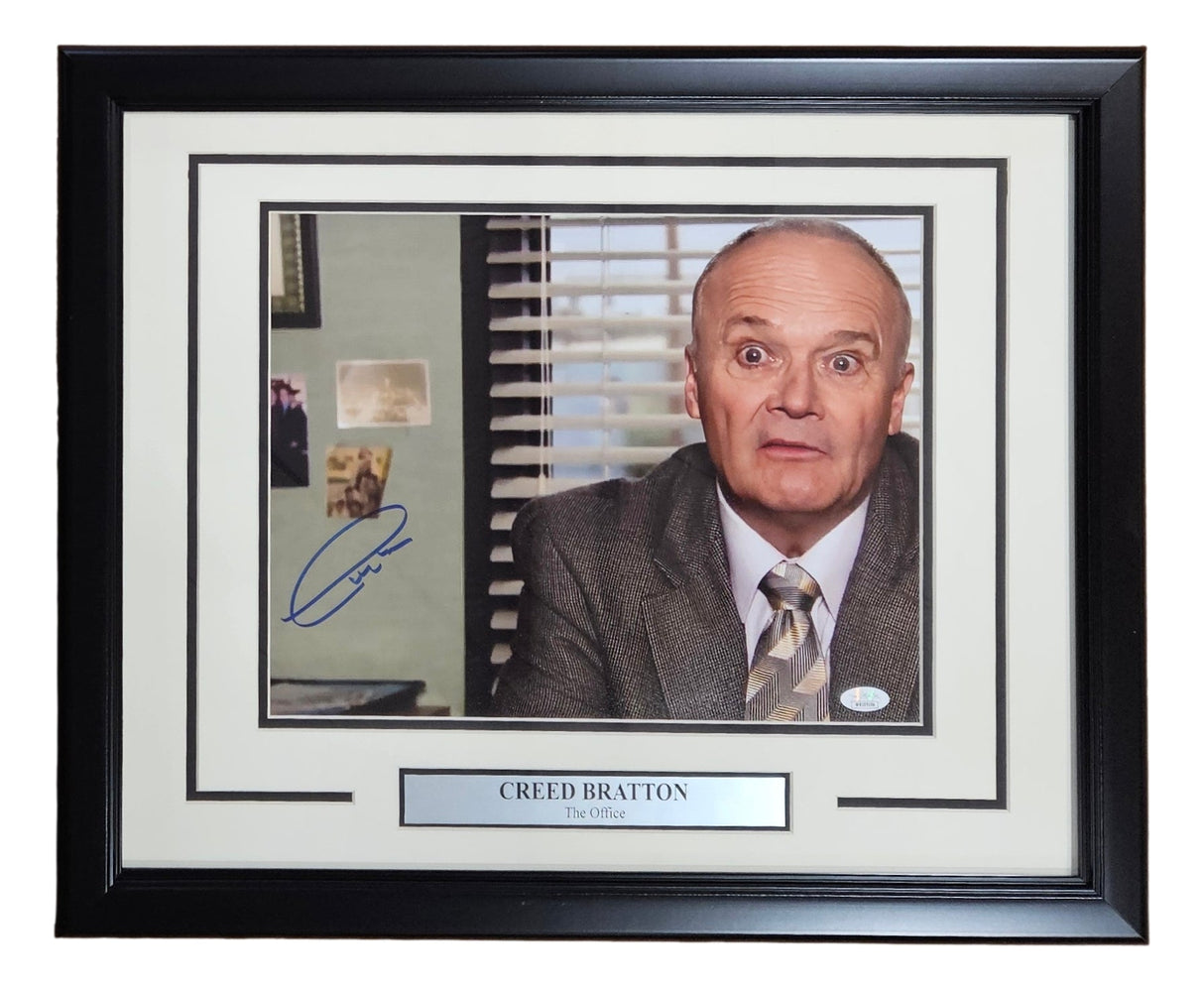 Sports Integrity Creed Bratton Signed Framed 11x14 Photo from The Office features Creed as Interim Manager with a surprised look, nameplate included. Authenticated by JSA ITP.