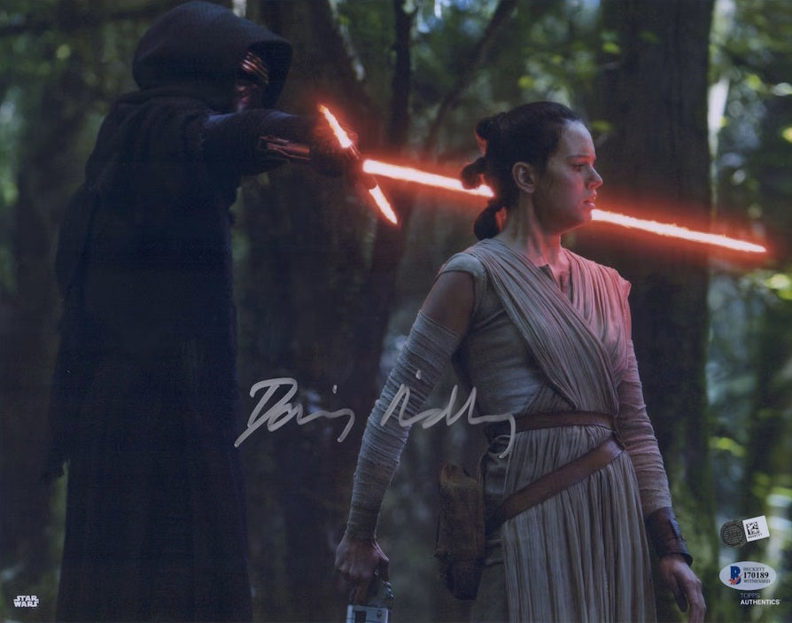 This Sports Integrity photo, titled "Daisy Ridley Signed 11x14 Star Wars The Force Awakens Photo Fanatics+BAS," features a tense scene of Rey confronted in the forest and comes autographed by Daisy Ridley.