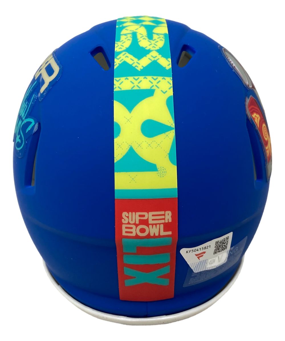 A Dallas Goedert signed Eagles Super Bowl LIX mini speed helmet by Sports Integrity, shown from the back with colorful graphics, SUPER BOWL LIX text, and a barcode sticker near the base.