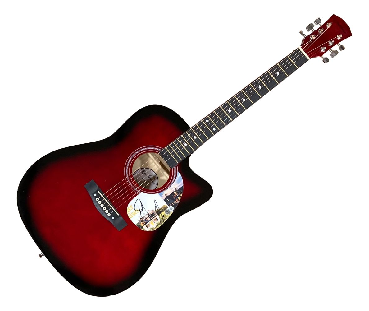 The Dan & Shay Signed 41" Bigger Houses Red Acoustic Guitar by Sports Integrity features a glossy red-black finish, steel strings, cutaway body, colorful pickguard graphics, and dot inlays on the fretboard.