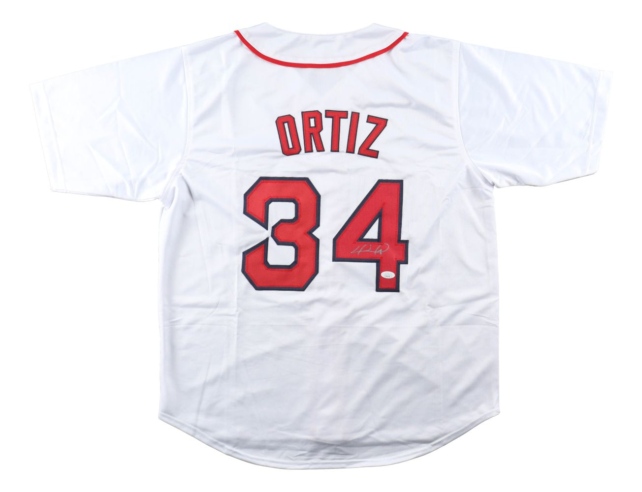 The Sports Integrity David Ortiz Boston Signed White Baseball Jersey (JSA) features red and black accents, Ortiz’s name and number 34 on the back, with a partial white ink signature.