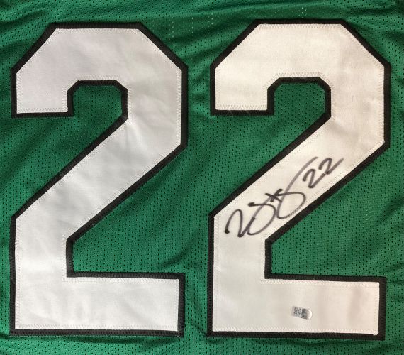 A Duce Staley Philadelphia Kelly Green football jersey by Sports Integrity, featuring large white 22 numbers outlined in black, with one "2" signed in black marker and an authentication sticker below the signature.