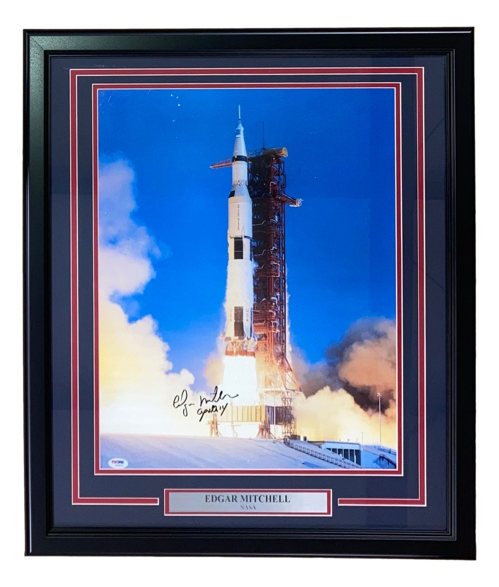 The Sports Integrity Edgar Mitchell Signed Framed 16x20 NASA Apollo 14 Photo features a Saturn V launch, includes a PSA/DNA authentication, and displays a plaque with his name and NASA.