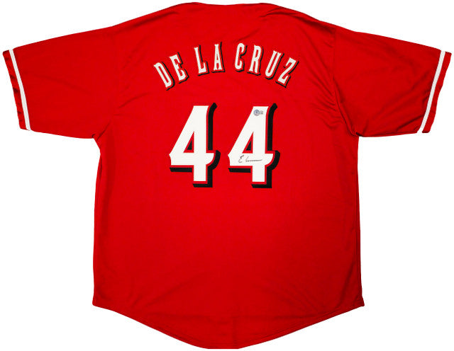 The Sports Integrity Elly De La Cruz Cincinnati Signed Red Baseball Jersey BAS features white and black trim, with De La Cruz and number 44 in bold white outlined letters on the back.