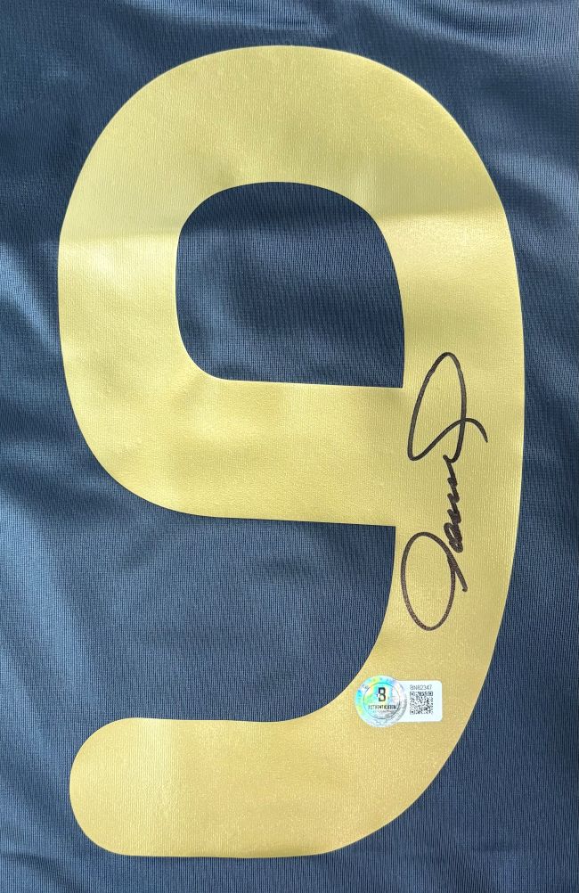 A Fernando Torres Signed Liverpool Black Adidas Soccer Jersey by Sports Integrity features a large gold number 9, signed with a marker and accompanied by an authentication sticker below the signature.