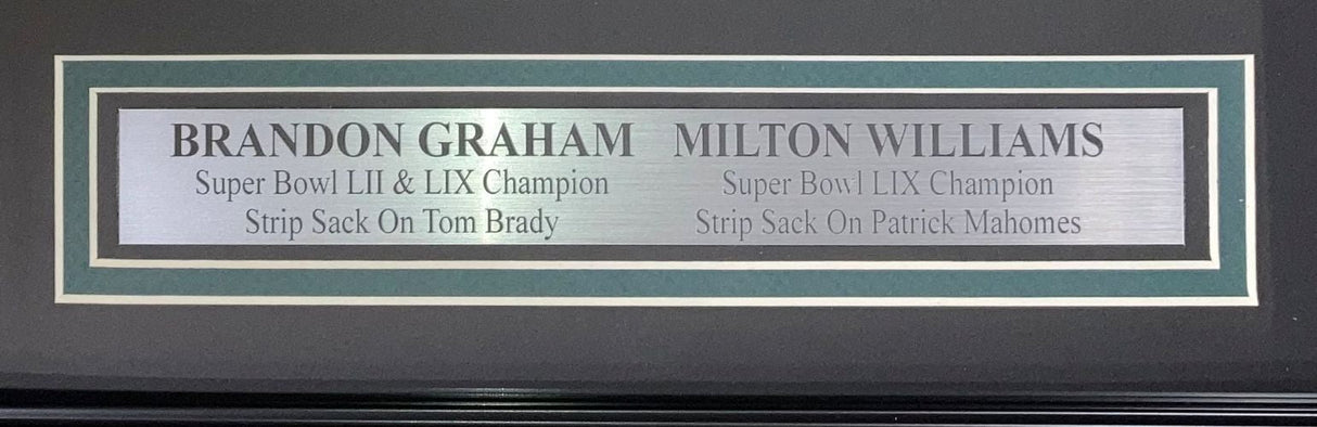 The Sports Integrity Graham Williams Signed Framed 16x20 Eagles Strip Sack Photo features Brandon Graham (Super Bowl LII & LIX, strip sack on Brady) and Milton Williams (Super Bowl LIX, strip sack on Mahomes).