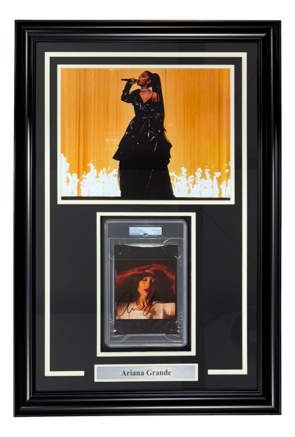 This Ariana Grande Signed Framed Eternal Sunshine CD Insert by Sports Integrity features an autographed card, 11x14 concert photo, and plaque, all elegantly displayed with a black background and white matting. Authenticated by PSA.