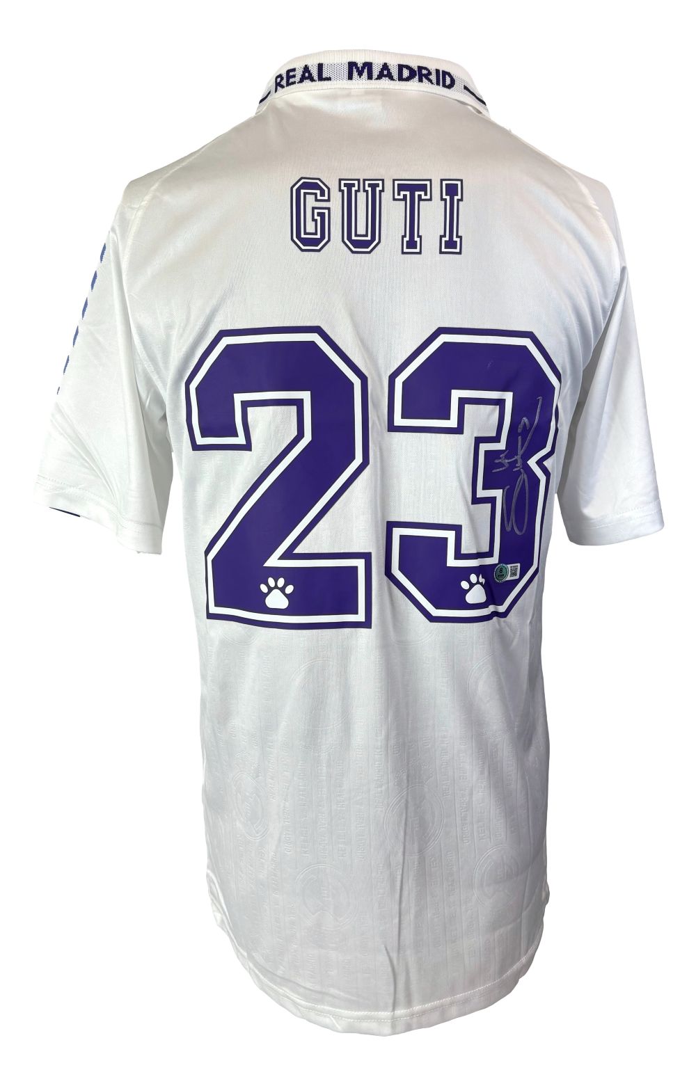 A white Sports Integrity Real Madrid Kelme soccer jersey, signed by Guti Hernandez with number 23 in purple, paw prints on the numbers, and "REAL MADRID" on the collar.